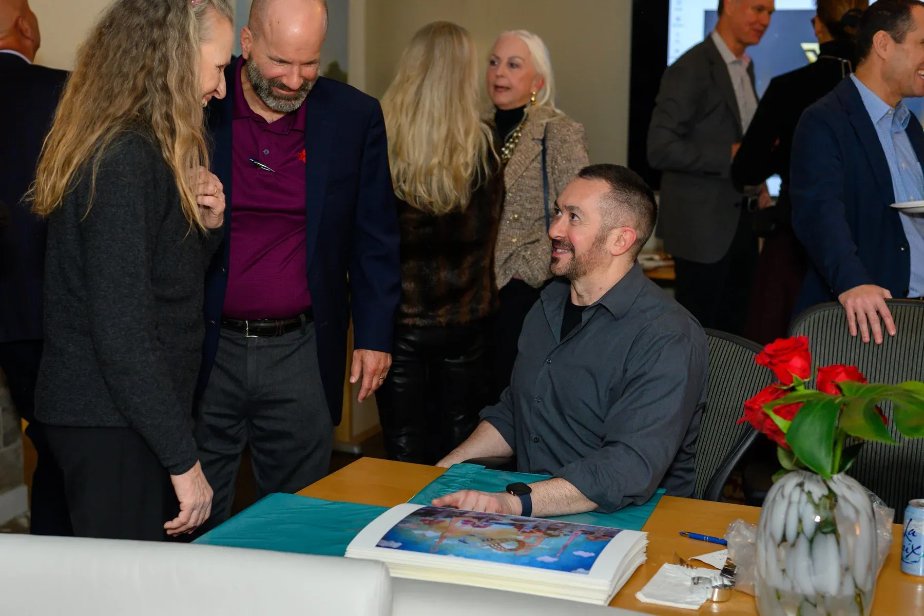 The Commission Artist signing prints