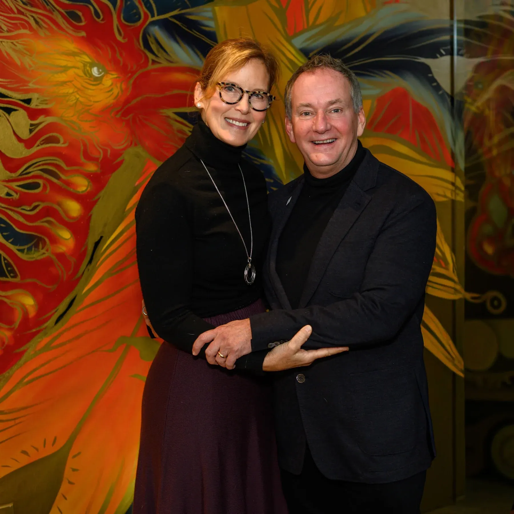 Guests at the commissioned mural
